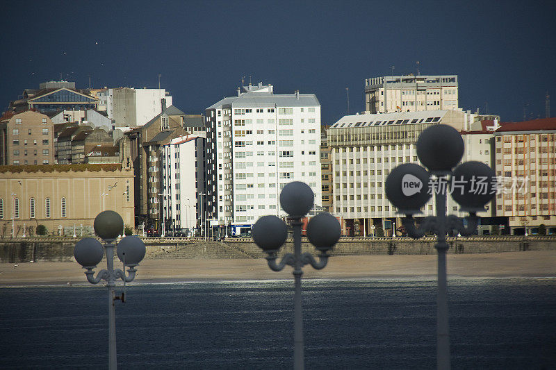 A Coruña  cityscape, seascape, beach and waterfront apartment buildings.